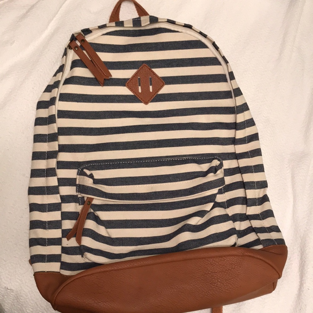 Blue, brown, and white canvas backpack